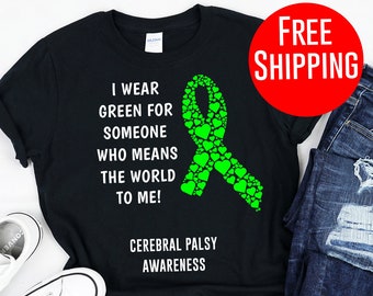 May include: Black t-shirt with a green ribbon made of hearts and the text "I wear green for someone who means the world to me! Cerebral Palsy Awareness".