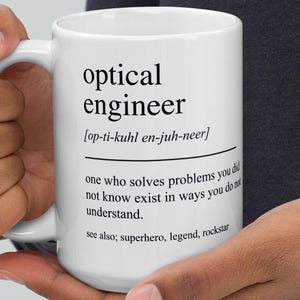 May include: A set of three ceramic mugs with a speckled, matte finish. Each mug features a different color: light blue, cream, and gray. The mugs have a simple, modern design and a comfortable handle.