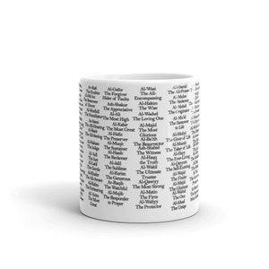 May include: White ceramic mug with black text listing the 99 names of Allah in Arabic and English. The names are arranged in a vertical column around the mug.