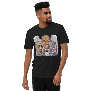 May include: Black t-shirt with a stained glass style image of three people with white angel wings behind them.