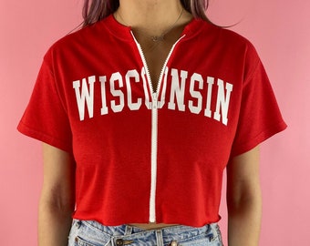 Camiseta corta con cremallera de la Universidad de Wisconsin