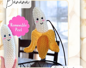 May include: A crocheted banana with a removable peel. The banana is yellow and white with a smiling face. The text "Banana" and "Removable Peel" are visible in the image. The text "Crochet pattern" is also visible in the image.