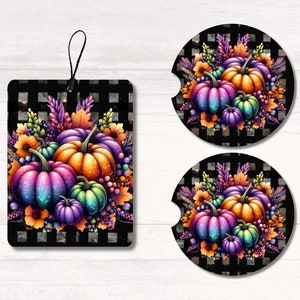 May include: A set of two black and white coasters featuring a colorful arrangement of pumpkins with iridescent glitter accents. The pumpkins are surrounded by fall foliage and berries.