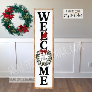 May include: A wooden welcome sign with the word "WELCOME" in large black letters. A red cardinal is perched on the letter "C". Below the "C" is a wreath with a red bow and the text "'tis the season". A green wreath with red poinsettias is to the left.