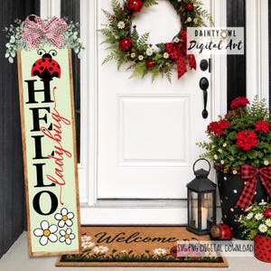May include: A ladybug-themed front porch display. A vertical sign reads "HELLO ladybug" with a ladybug and daisy design. A wreath, flower pots, and doormat create a welcoming entrance.