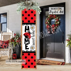 May include: A wooden sign with a red and black polka dot design and the words "HOME sweet home." The sign features a ladybug graphic and is decorated with greenery and a bow at the top. A wreath with ladybug accents hangs on the door.