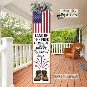 May include: A wooden sign featuring an American flag design at the top, with the text "LAND OF THE FREE, HOME OF THE BRAVE, Remember and Honor." The bottom of the sign displays a pair of military boots and fireworks.