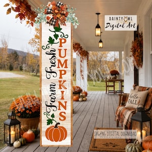 May include: A vertical wooden porch sign with a white wood grain background featuring the text Farm Fresh PUMPKINS in black and orange, green vine accents, a large orange pumpkin at the base, and a decorative plaid bow at the top.
