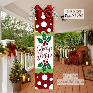 May include: A vertical porch sign featuring a deep red background with white polka dots, a central white panel with green holly leaves, red berries, and the text Holly Jolly in red script, topped with a large red bow and eucalyptus greenery.