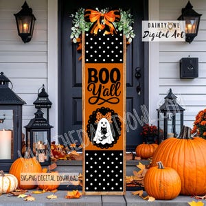 May include: A vertical rectangular Halloween porch sign featuring a black and white polka dot pattern at the top and bottom, with an orange center section displaying the text BOO Y'ALL and a graphic of a ghost holding a black cat.
