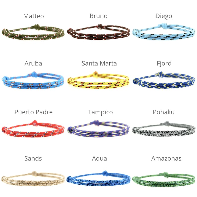 May include: A collection of twelve adjustable cord bracelets in various colors including olive, brown, light blue, bright blue, yellow, navy, red, purple, grey, beige, royal blue, and green, each featuring a double-strand design and a sliding knot.