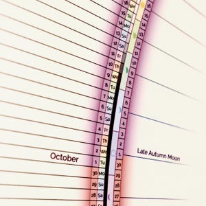 May include: A calendar with a pink, purple, and blue gradient background. The calendar shows the month of October with the days of the week labeled. The calendar also shows the phases of the moon for each day. The text "Late Autumn Moon" is visible in the lower right corner.