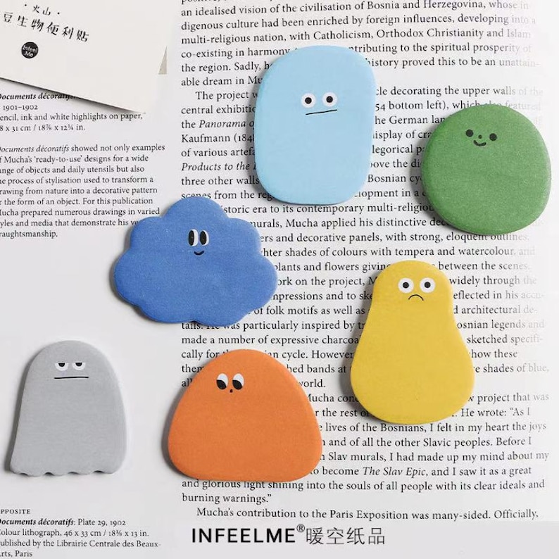 May include: A set of colorful, whimsical sticky notes shaped like clouds and ghosts. Each note features a simple cartoon face with different expressions. The notes are perfect for adding a touch of fun to any workspace or planner.