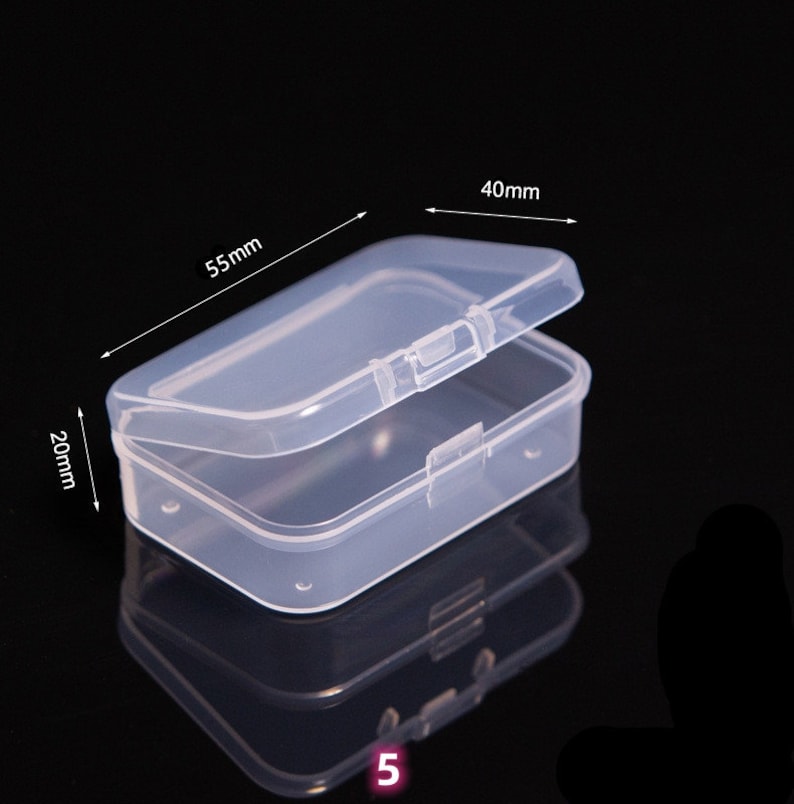 May include: Clear plastic storage box with a hinged lid. The box measures 5.5 inches long, 4 inches wide, and 2 inches tall.