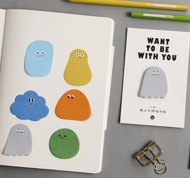 May include: A set of colorful sticky notes featuring cartoon characters with different expressions. The notes are shaped like clouds, ghosts, and other whimsical figures. The text on the card reads "Want to be with you".