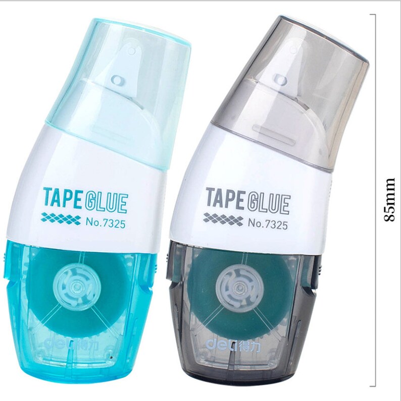 May include: Two tape glue dispensers, one blue and one grey, with the text "TAPE GLUE No.7325" on each. The dispensers are 21.6 cm tall.