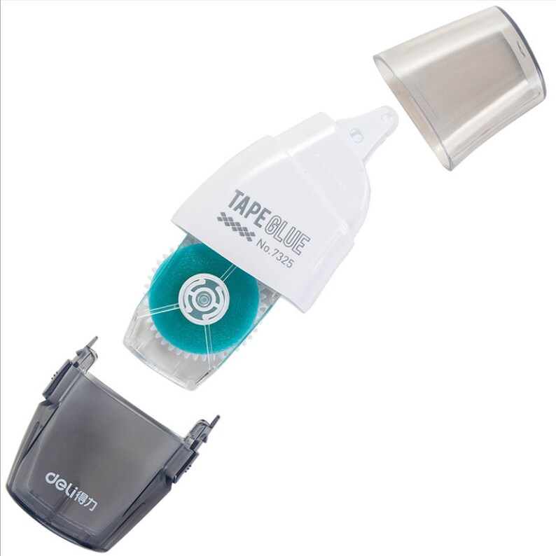 May include: A white tape glue dispenser with a clear plastic window showing a blue tape roll. The dispenser has the text "TAPE GLUE No. 7325" printed on it. The dispenser is separated into two parts, with the top part removed and the bottom part showing a grey plastic base with the text "deli" in Japanese characters.