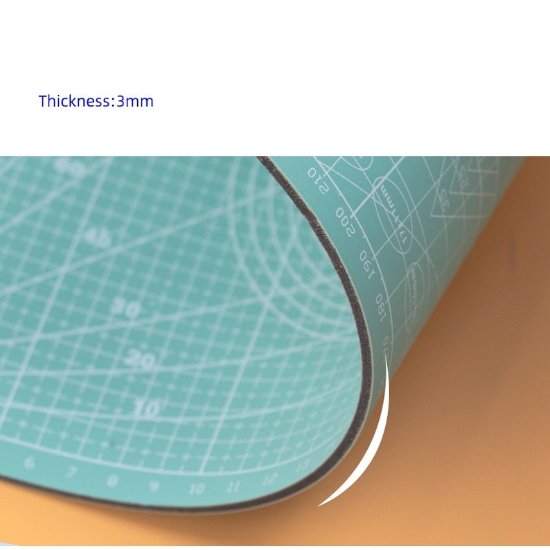 May include: A green self-healing cutting mat with a grid pattern and measurements in inches. The mat is 3mm thick and has a black edge.