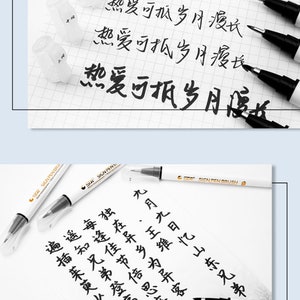 以下が含まれることがあります： 白地に金色のアクセントが付いた、黒の細字マーカーのクローズアップ。マーカーは、白い表面に「STA SIGN PEN BRUSH」と「热爱可抵岁月漫长」という黒い文字が書かれており、「愛は時の試練に耐えることができる」と訳されます。