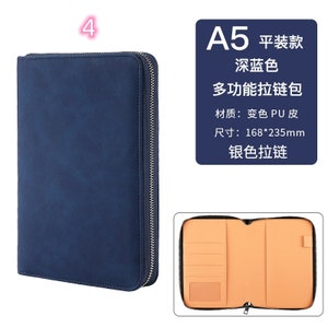 K&ouml;nnte beinhalten: Ein marineblaues A5-Rei&szlig;verschluss-Portfolio. Das geschlossene Portfolio ist links abgebildet, das offene Portfolio unten. Der Innenraum ist beige mit mehreren Taschen. Der Text lautet: "A5, tiefblau, multifunktionale Rei&szlig;verschlusstasche, PU-Leder, Gr&ouml;&szlig;e: 168*235mm, silberner Rei&szlig;verschluss."