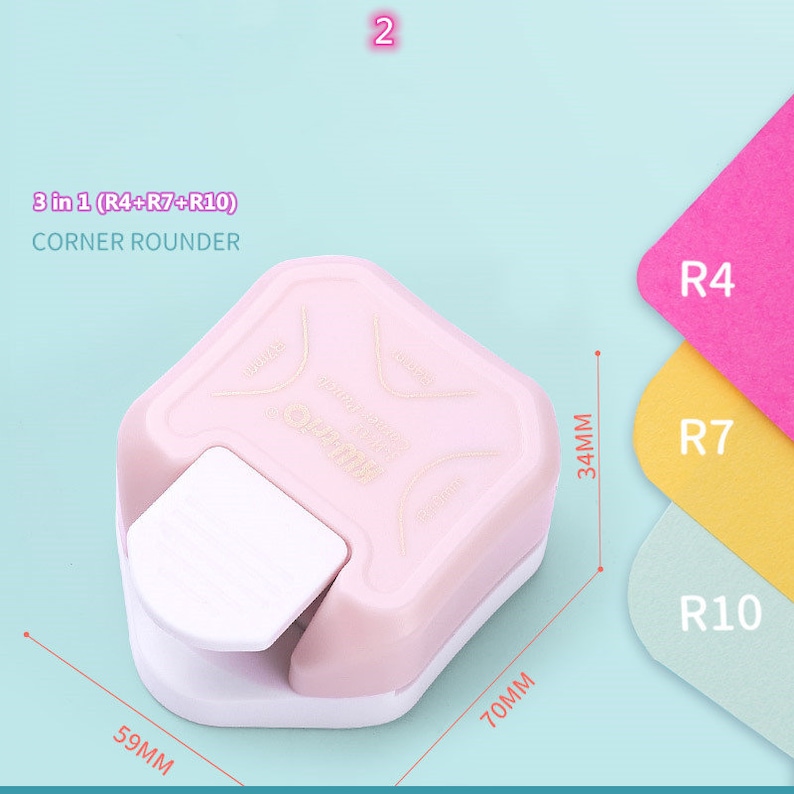 May include: A pink corner rounder tool with three different sized rounder options: R4, R7, and R10. The tool measures 15 cm by 18 cm and 8.6 cm tall.