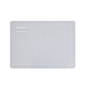 May include: A gray self-healing cutting mat with a grid pattern and numbers 1 through 13 along the top and bottom edges. The mat is labeled "Junesix Cutting Mats".