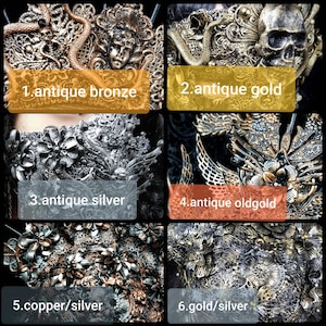May include: A collection of six ornate masks featuring intricate filigree, floral motifs, skulls, and snakes. The finishes include antique bronze, antique gold, antique silver, antique oldgold, copper/silver, and gold/silver, each labeled with its color.