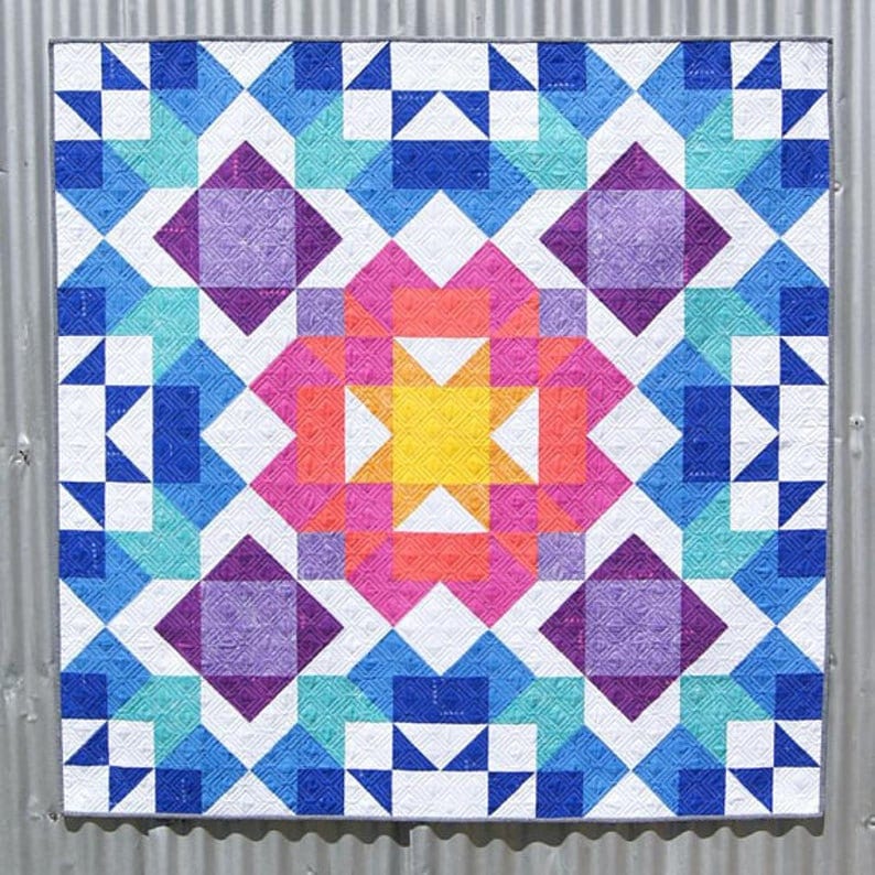Two sizes included Easy quilt using half square triangles Quilt pattern Aurora Quilt Designed by Jemima Flendt for Tied with a ribbon
