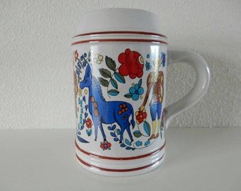 Beer mug with folklore decoration