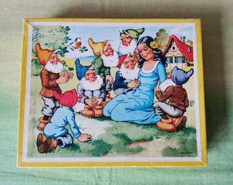 Two wooden puzzles; 'Snow White' and 'Happy Hans'