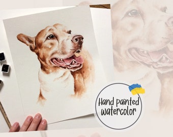 May include: Hand painted watercolor portrait of a brown and white dog with its tongue sticking out. The painting is on a white background and is framed by a white border.