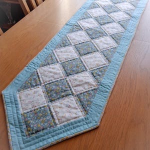 Liberty fabric quilted patchwork table runner in blue, yellow and cream