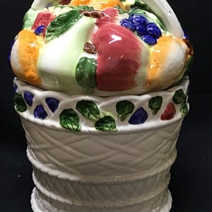 Vintage ceramic cookie jar canister. white basket with fruit design lid