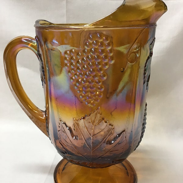 Vintage gold carnival glass pitcher. Harvest grape pattern.