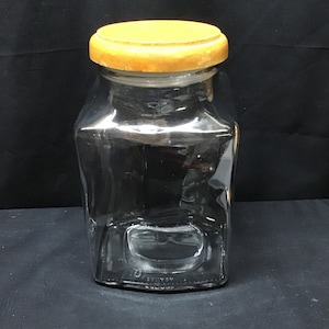 Vintage positional canister.  Apothecary jar.....Plastic seal.. 9 inches tall