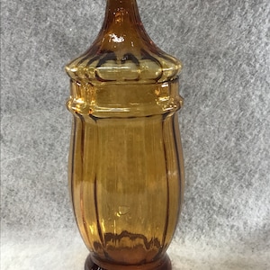 Empole Italian Apothecary Jar with lid. Gold color. Ribbed design.