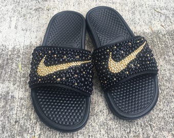 black and gold nike slides