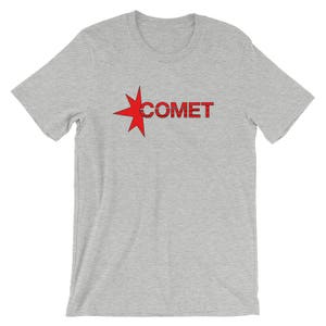 May include: A gray t-shirt with a red star and the word "COMET" printed on the front.