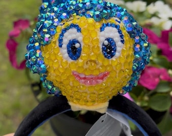 Diadema de peluche y llavero inspirados en Alegría de Inside Out con incrustaciones de pedrería.