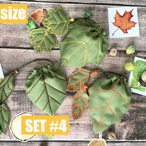 May include: Green leaf-shaped drawstring bags with brown and orange accents. The bags are arranged with leaf-shaped embellishments and small dice. The text "S SIZE" and "SET #4" are visible.