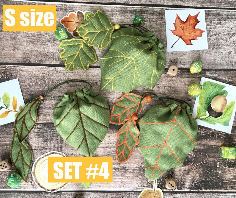 May include: Green leaf-shaped drawstring bags with brown and orange accents. The bags are arranged with leaf-shaped embellishments and small dice. The text "S SIZE" and "SET #4" are visible.
