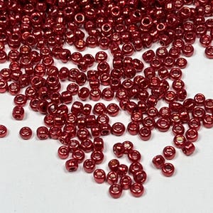 Perline di vetro color rosso metallizzato, 12/0, circa. 2,5 mm, 10 g.