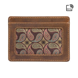 May include: A brown leather card holder with a paisley pattern inside the window. The card holder has RFID blocking technology.