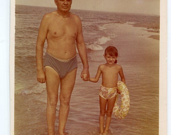 Beautiful girl children on beach summer holidays snapshot vintage photo found photo