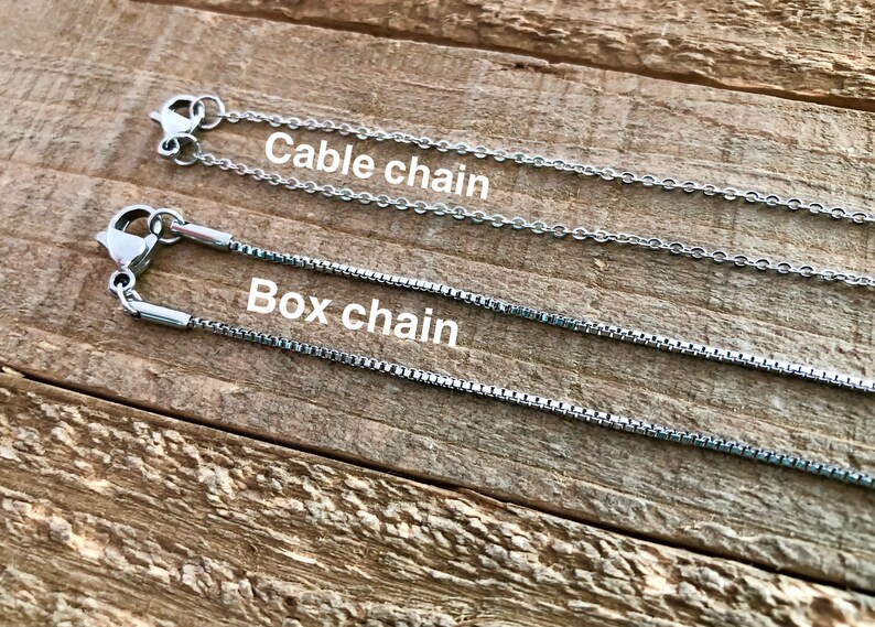 May include: Two silver chains, one labelled "Cable chain" and the other labelled "Box chain".