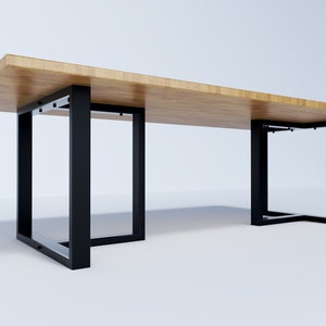 May include: A long wooden table with black metal legs. The table has a rectangular top and the legs are square.