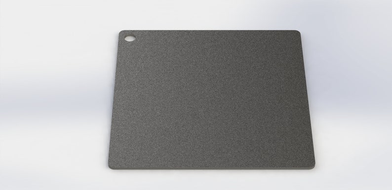 May include: A gray square cutting board with a small hole in the top corner.