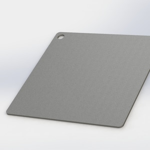 May include: A gray metal square with a small hole in the top corner.