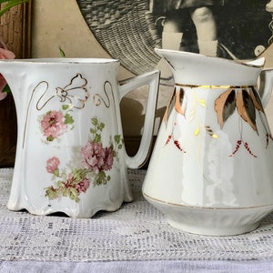Two Small French Antique Porcelain Jugs / One in White with Charming Floral Decor & Lovely Gold Detail / One With Hand Painted Leaf Decor