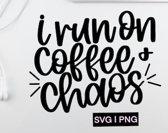 May include: Black and white text graphic that reads "I run on coffee & chaos" with a white background. The text is in a handwritten style font. The graphic also includes the text "SVG I PNG" in smaller font.
